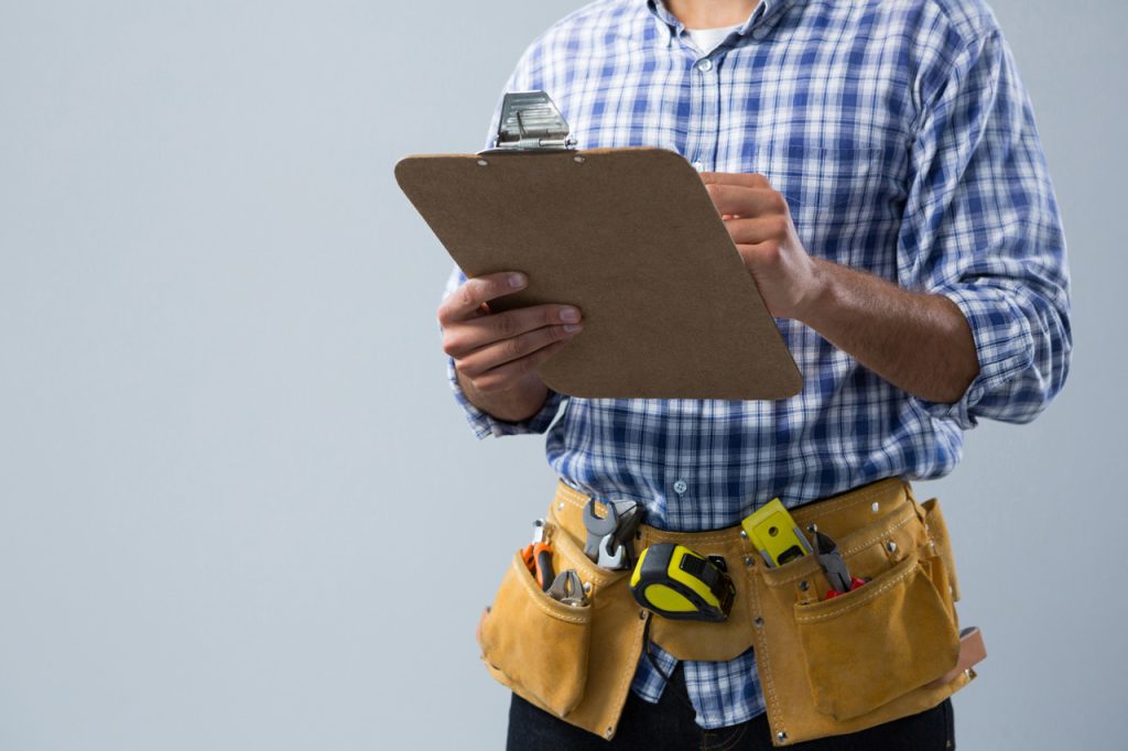 male architect looking at clipboard 2026 01 09 09 38 34 utc